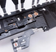 What are the characteristics and considerations of the injection molded metal insert process?